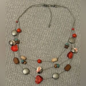 Bohemian theme silver tone triple stranded necklace